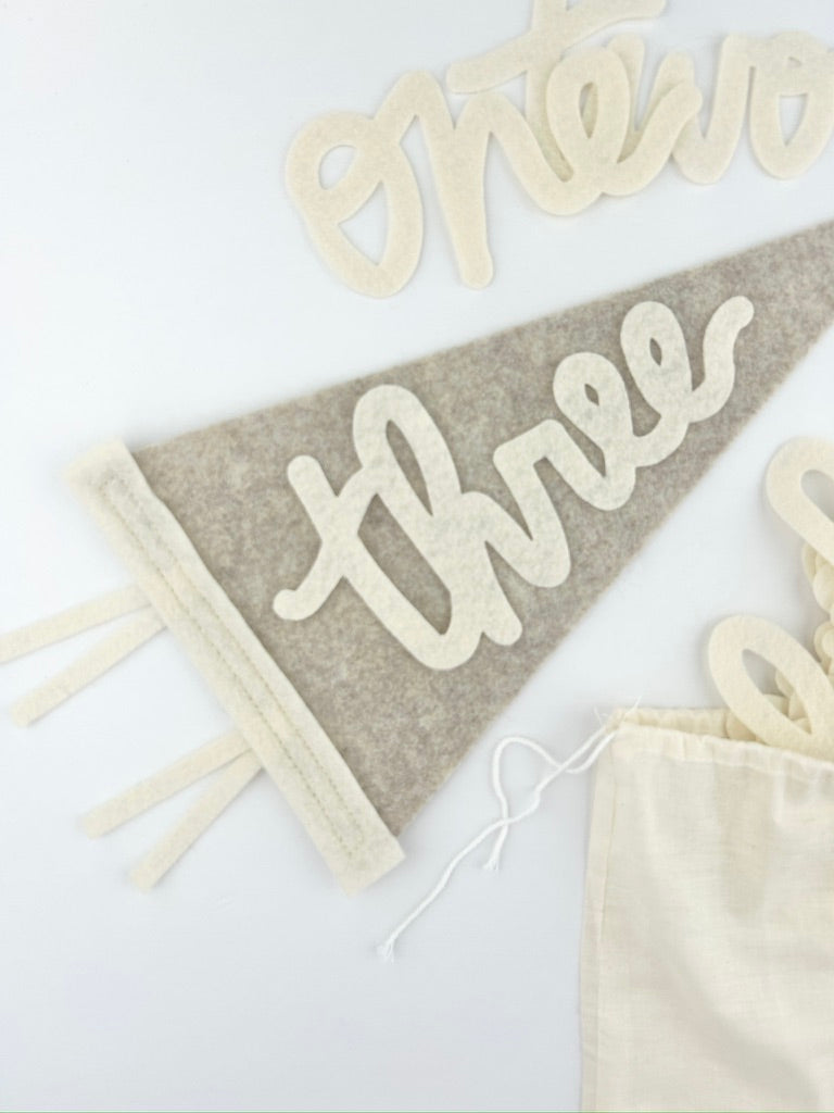 Monthly Milestone Pennant // beige with cream, cursive numbers - Eventide Pennant Co.