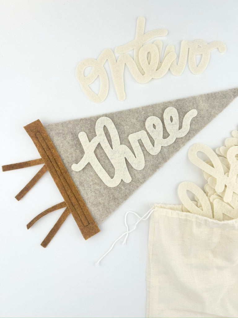 Monthly Milestone Pennant // beige with chestnut, cursive numbers - Eventide Pennant Co.